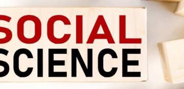 SOCIAL SCIENCE. Text on wood block on white background